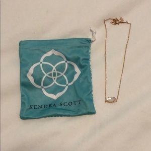 Kendra Scott gold necklace with white pendant